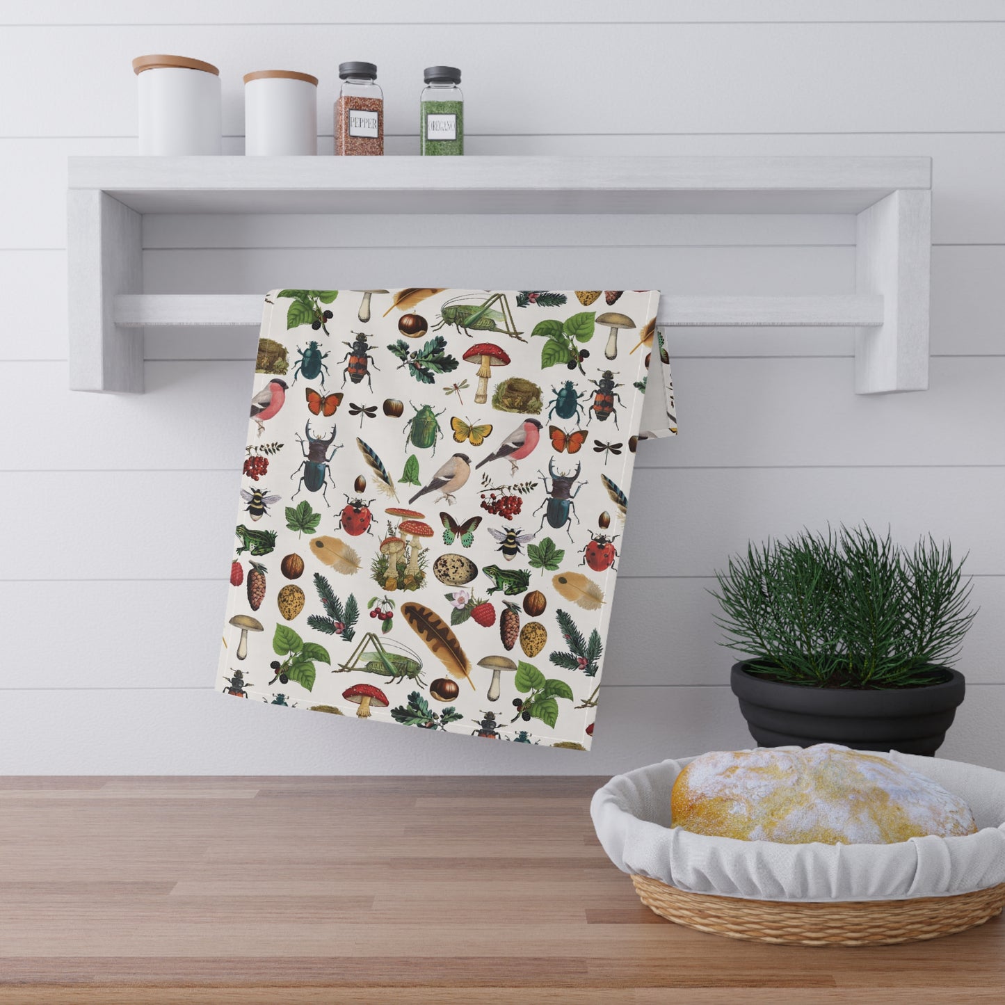 Bugs and leaves tea towel.