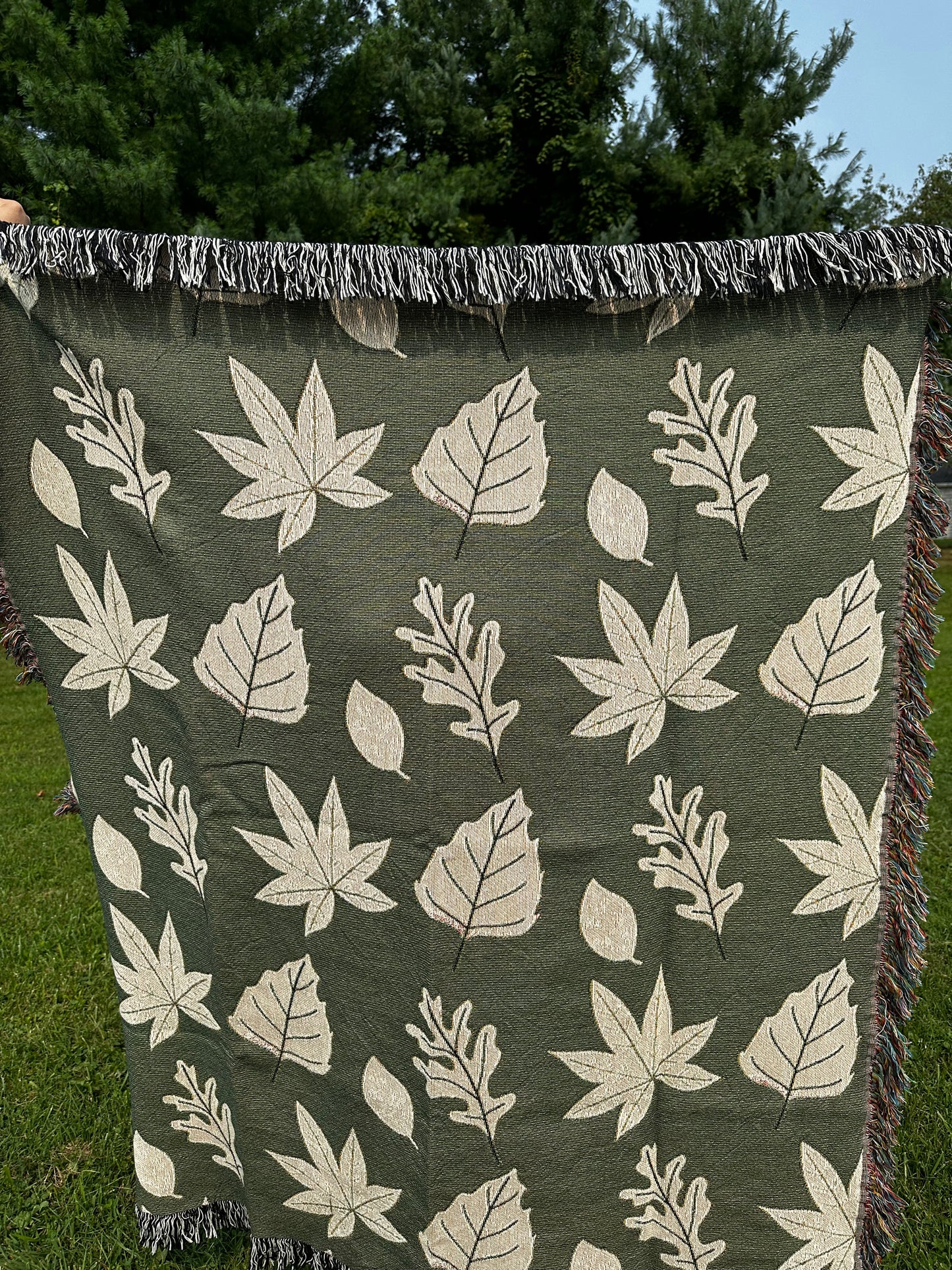 Fall leaves with green background woven blanket 50x60”