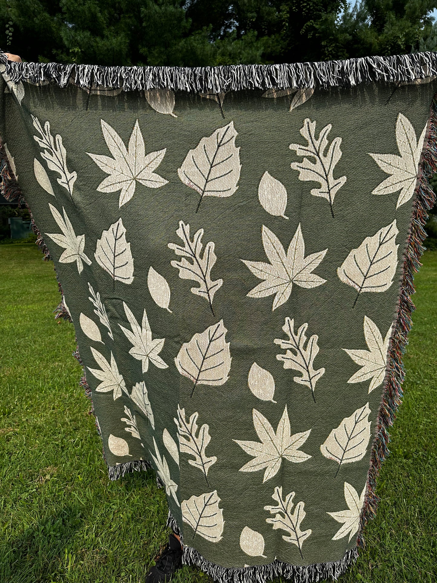 Fall leaves with green background woven blanket 50x60”