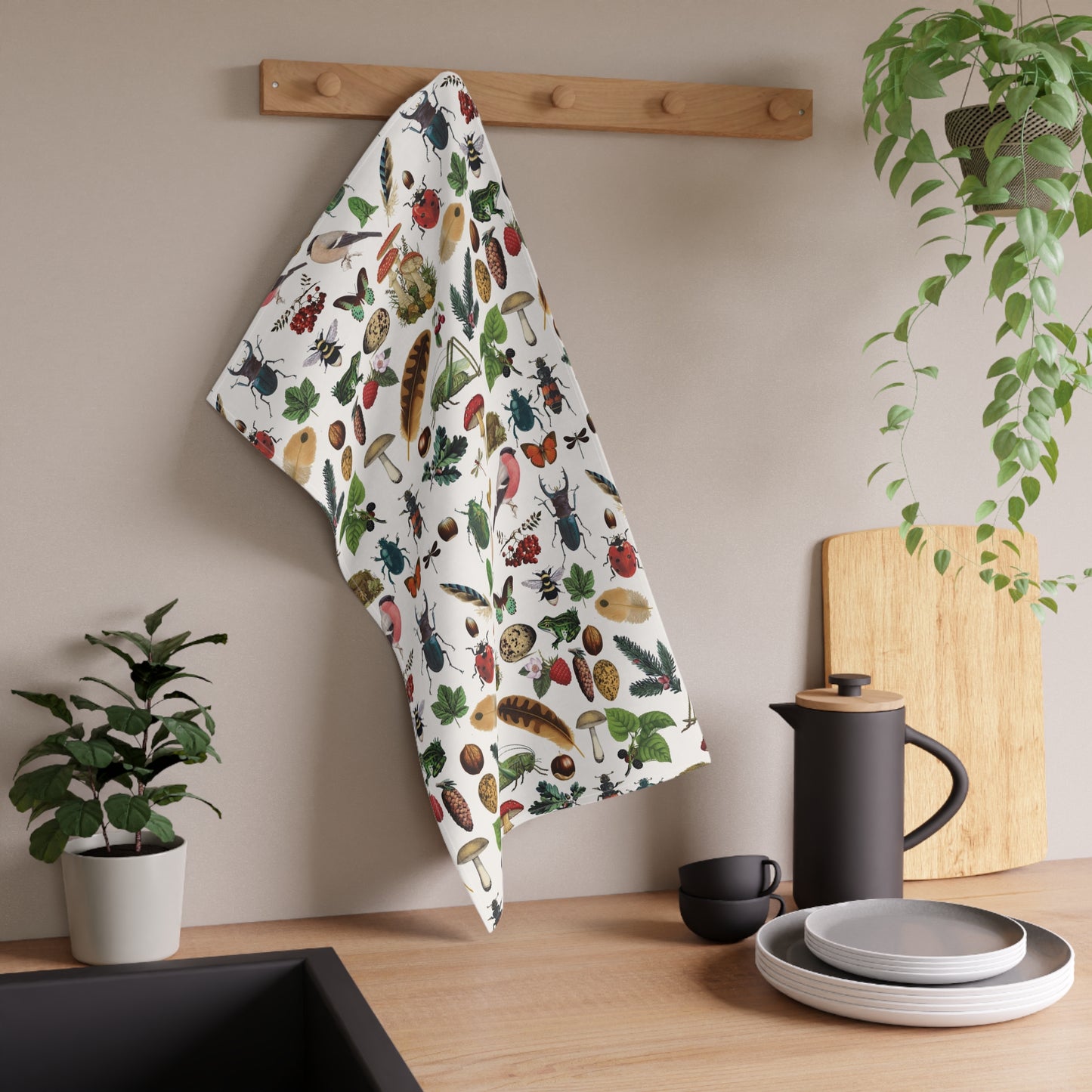 Bugs and leaves tea towel.