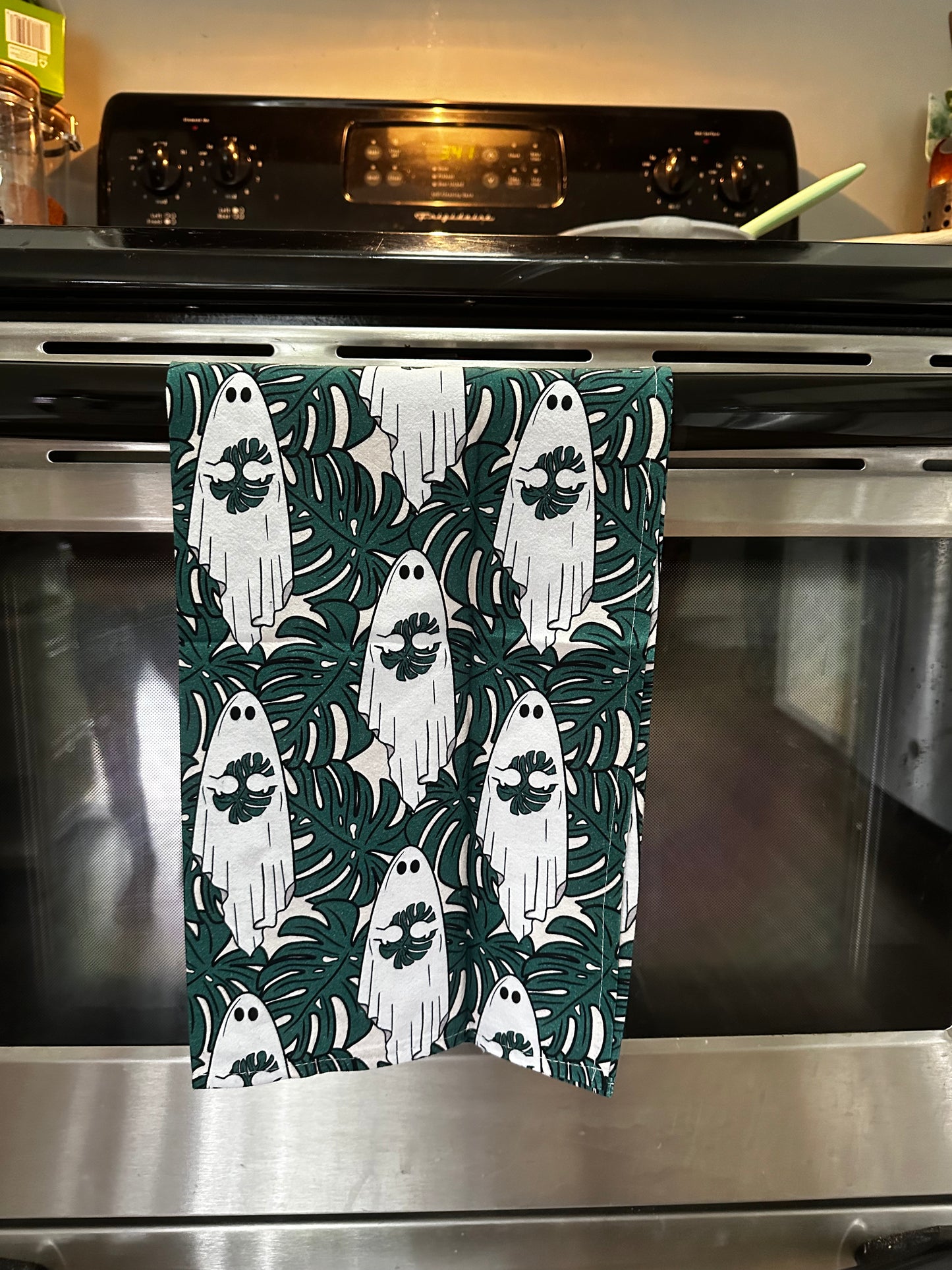 Cute ghost holding monstera leaf tea towel. Set of 2 cotton kitchen towels.